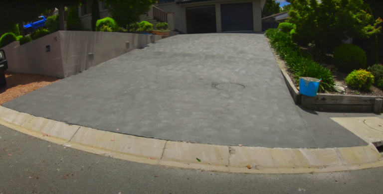 This image is of Concreters Townsville resurfacing a concrete driveway in Townsville, QLD.